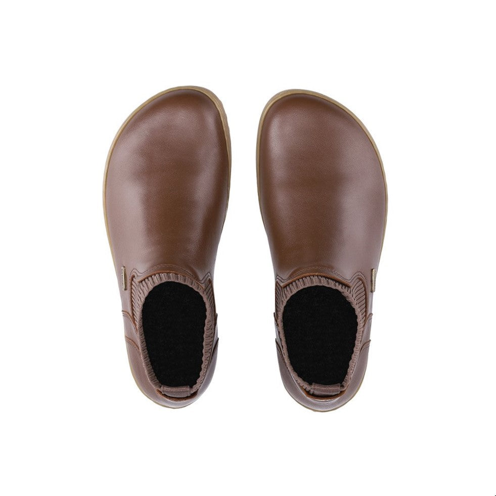 A photo of Be Lenka Mojo boots in dark brown with tan soles. Boots are made from smooth black leather and a knit opening hugging around the ankle. Both boots are shown from the top down against a white background. #color_dark-brown
