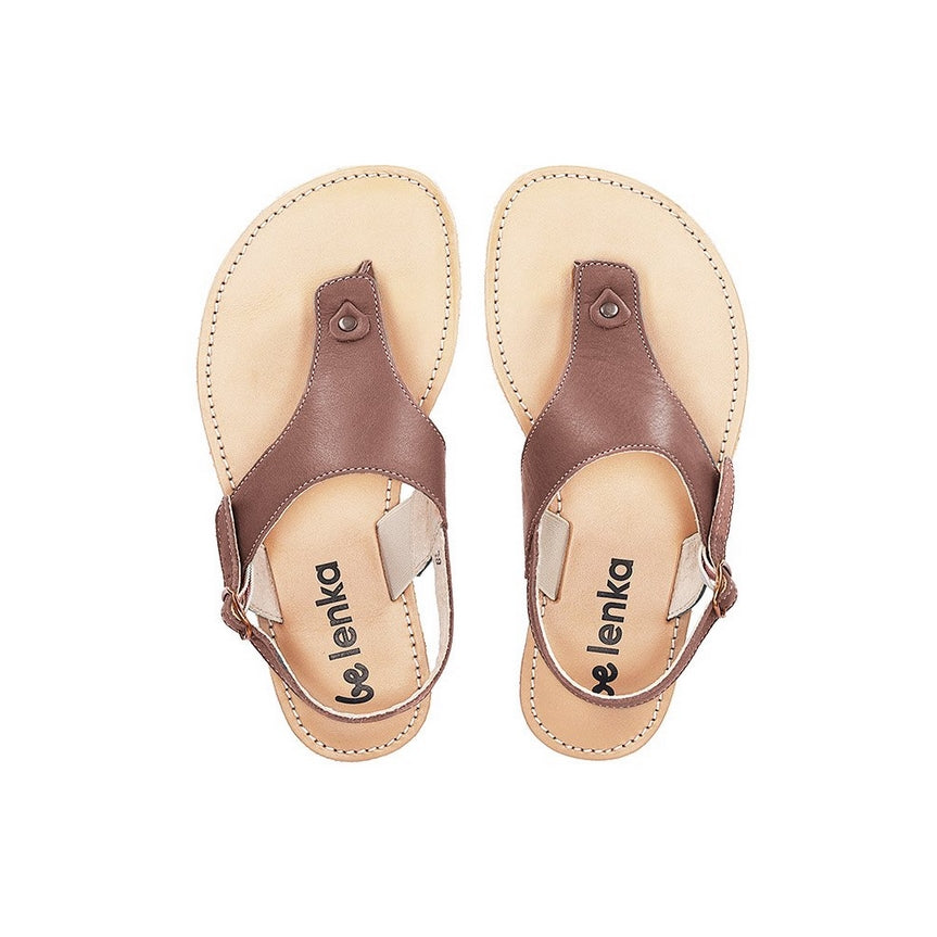 A photo of Dark Brown Be Lenka Promenade Sandals made with leather and tan rubber soles. The sandals have dark brown thong straps and a heel strap with a buckle. Both sandals are shown from the top down beside each other against a white background in this photo. #color_dark-brown