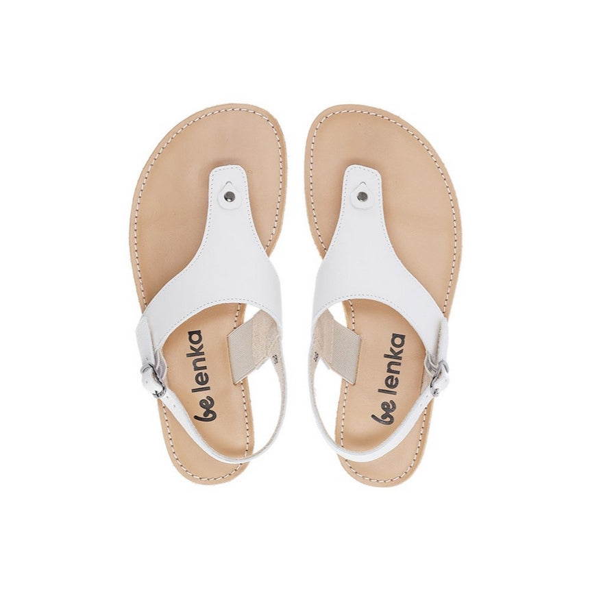 A photo of leather Ivory Be Lenka Promenade Sandals with tan leather and rubber soles. The sandals have ivory thong straps and a heel strap with a buckle. The sandals are shown from the top down against a white background. #color_ivory