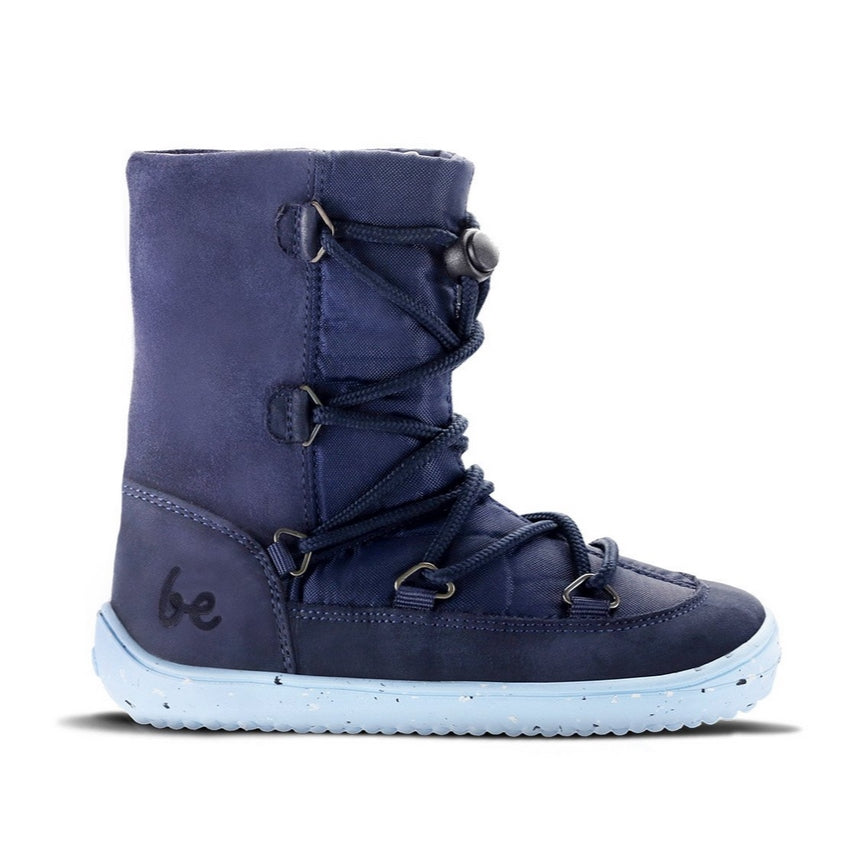 A photo of Be Lenka Kids Snowfox boots in dark and light blue. Dark blue suede and textile and light blue soles surround the outside. Dark blue laces are widely connected from side to side starting at the ball of the foot and going until the top of the boot with a quick lace connector securing the laces in place. Shoe is shown from the right side against a white background. #color_dark-light-blue
