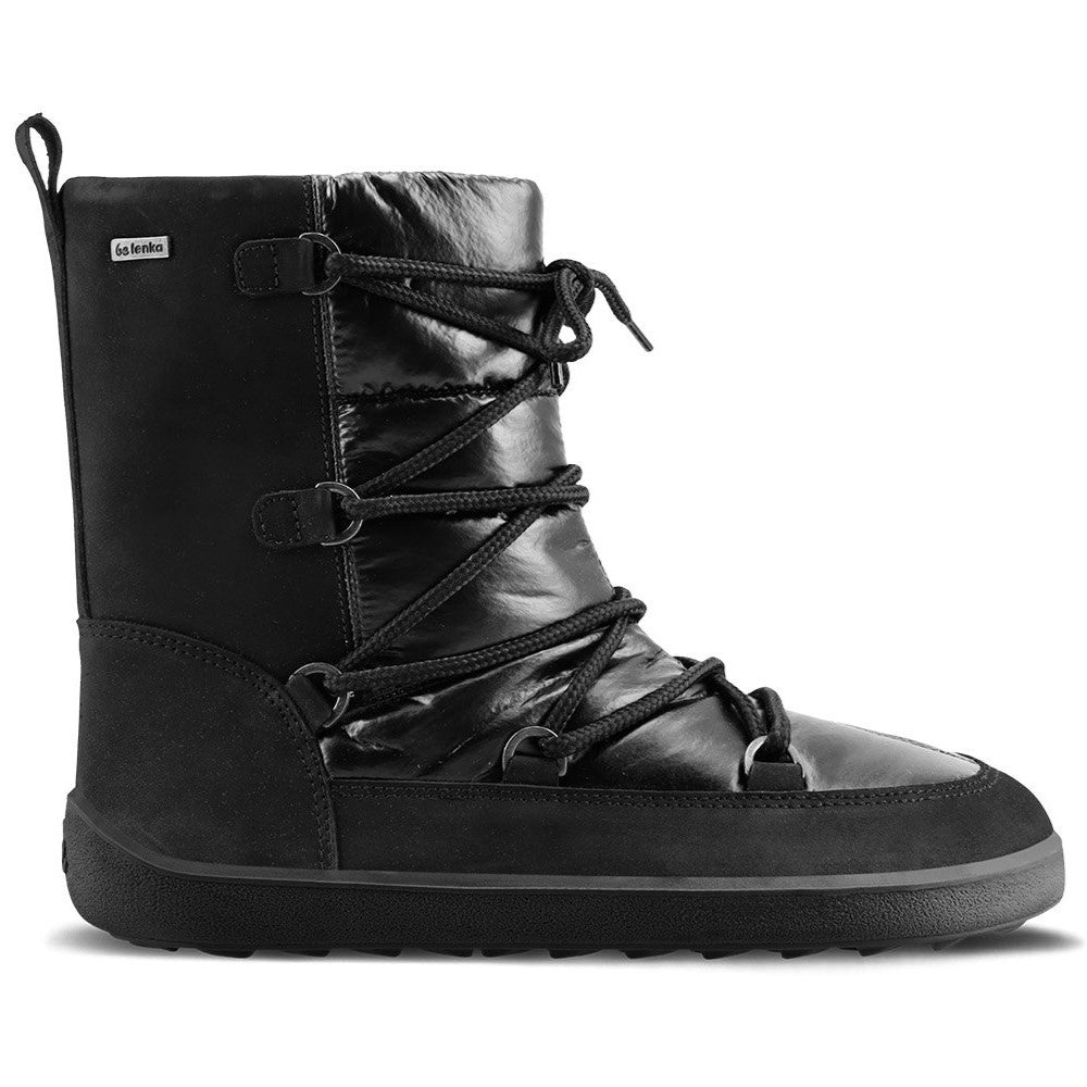 A photo of Be Lenka Adult Snowfox boots in all black. Black leather goes around the back with black satin over the top and front, and black soles. Laces are widely connected from side to side starting at the ball of the foot and going until the top of the boot. Right shoe is shown from the right side against a white background. #color_black