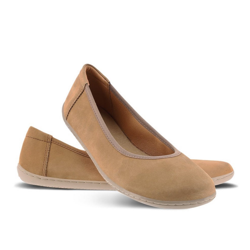 A photo of Toffee Brown Be Lenka Sophie Simple Leather flats with gum soles. Left shoe is shown from the right with the right shoe propped up on the left to show the top of the shoe. Background is white. #color_toffee-brown