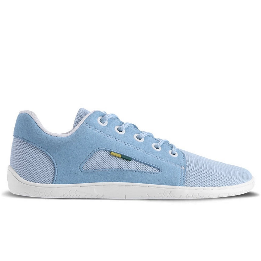 Photo 1 - Be Lenka Whiz mesh sneakers in light blue. Sneakers feature a grey mesh fabric with an overlaying soft fabric around the top of the heel, on the bottom sides, and surrounding the lace eyelets. A triangle cut out shows the mesh fabric under the soft fabric on the sides of the sneaker. Shoe is shown from the right side with a white background., Photo 2 - Be Lenka Whiz mesh sneakers in light blue. Both shoes are shown from the top down against a white background. #color_light-blue