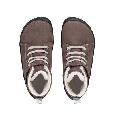 Photo 1 - A photo of Be Lenka Winter Kids boots in Chocolate with black soles. Boots are slightly above ankle height, have elastic laces, and a velcro ankle strap closure. Right shoe is shown from the right side against a white background. Photo 2 - Both shoes are shown from the top down against a white background. #color_chocolate
