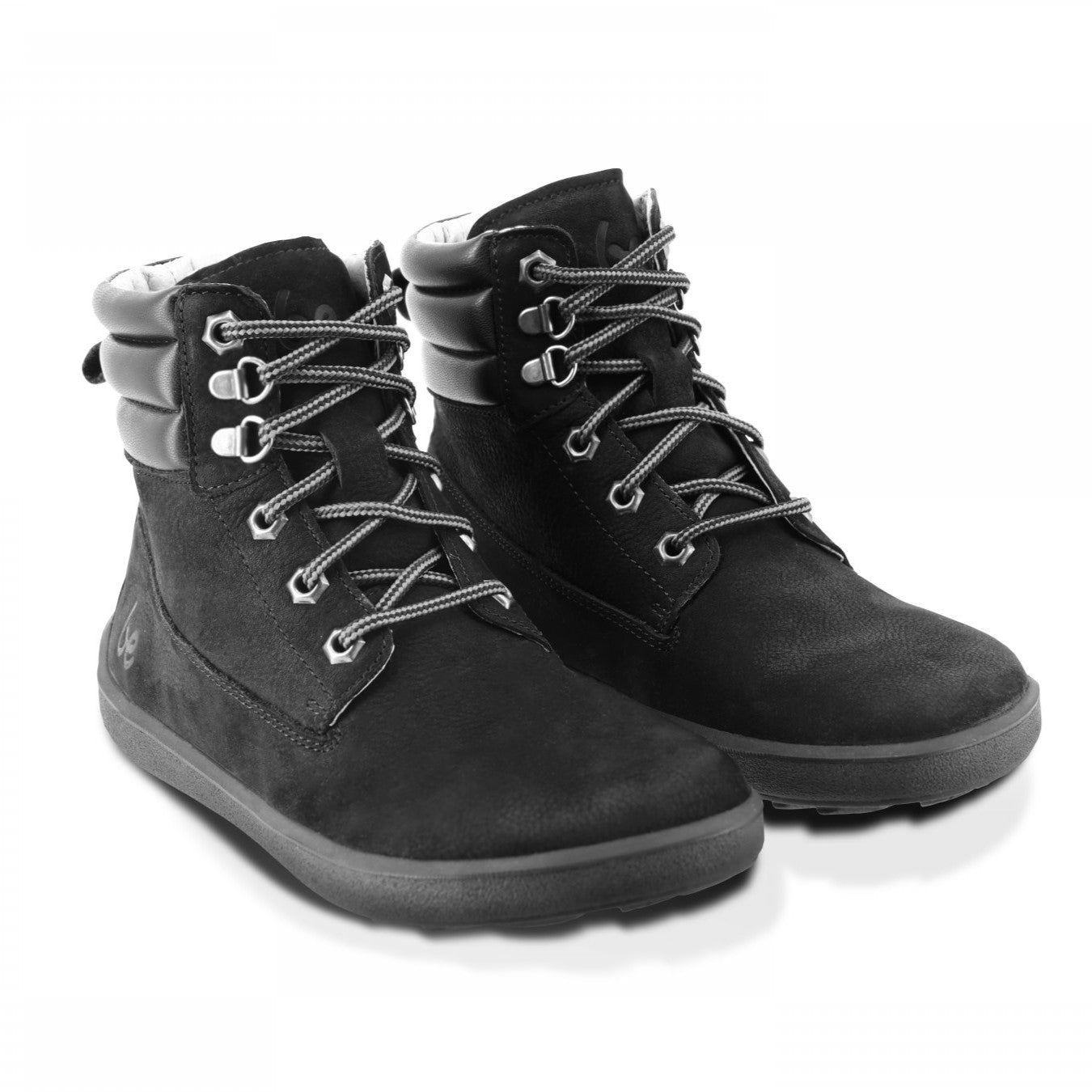 A photo of Be Lenka Nevada Boots made from nubuck leather and rubber soles. The boots are black in color, they are combat boot style with laces a padded color and a chunky eyelets. Both boot are shown beside each other angled slightly to the right against a white background. #color_black