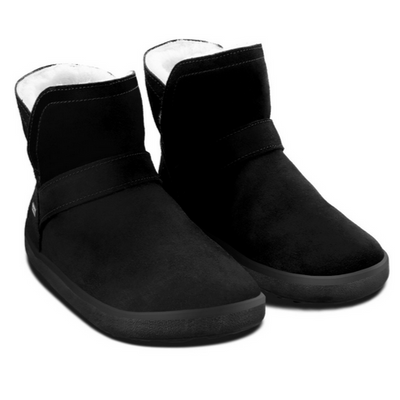 A photo of Belenka Polaris made from nubuck leather, sheepskin, and rubber soles. The boots are black in color they are a slip on with sheepskin inside. Both boots are shown from the right angled slightly to the front against white background. #color_black