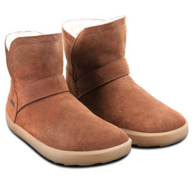 A photo of Belenka Polaris made from nubuck leather, sheepskin, and rubber soles. The boots are brown in color they are a slip on with sheepskin inside. Both boots are shown from the right angled slightly to the front against white background.  #color_brown