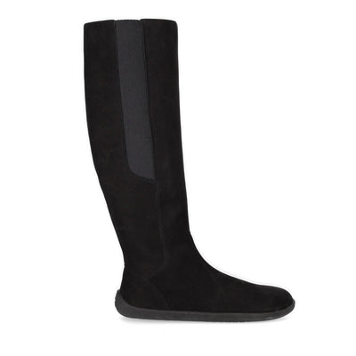 A photo of Belenka Sierra made from nubuck leather, fleece, and rubber soles. The boots are black in color with a tall riding boot elastic paneled shaft lined with fleece. One boot is shown from the right side against a white background.  #color_matt-black