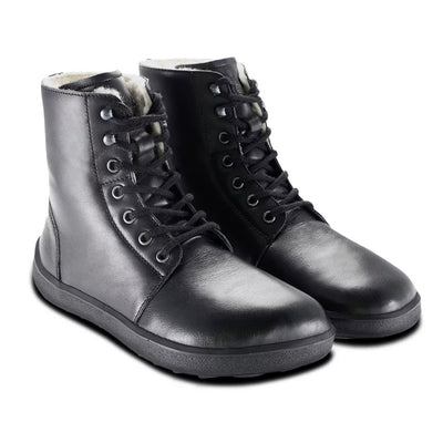 A photo of Be Lenka Winter Neo boots made with leather and rubber soles. The boots are black in color and a lace up style with wool inside. Both boots are shown beside each other angled slightly to right against a white background. #color_black-smooth-leather