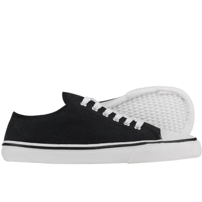 A photo of Bohempia Herlik canvas sneakers made from canvas and rubber soles. The sneakers are a black color with a white toe cap and a black outline around the white rubber soles. The right sneaker is shown from the right side against a white background, with the sole of the left shoe shown in the background. #color_black-white