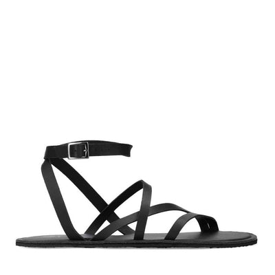 A photo of black leather Groundies Florence Sandals. Two leather straps start at the ball of the big toe with one ending at the ball of the little toe and the other midfoot. Another strap goes from one side of the heel over the top of the foot to the other side with one final strap wrapping around the ankle and closing with a buckle. Shoe is shown from the right side against a white background. #color_black