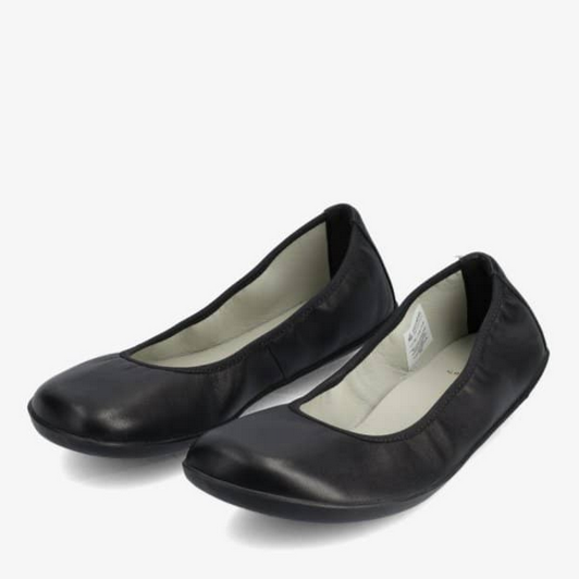 A photo of Groundies Lily Soft flats with a leather upper and black rubber true sense soles. The flats are a smooth leather in a black color with trim around the tops. The interior of the flats is a light beige color. Both flats are shown beside each other facing to the left with the left flat on the outside against a white background. #color_black