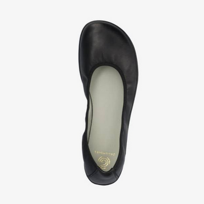 A photo of Groundies Lily Classic flats with a leather upper and black rubber true sense soles. The flats are a smooth leather in a black color with trim around the tops. The right flat is shown floating facing downwards against a white background. #color_black