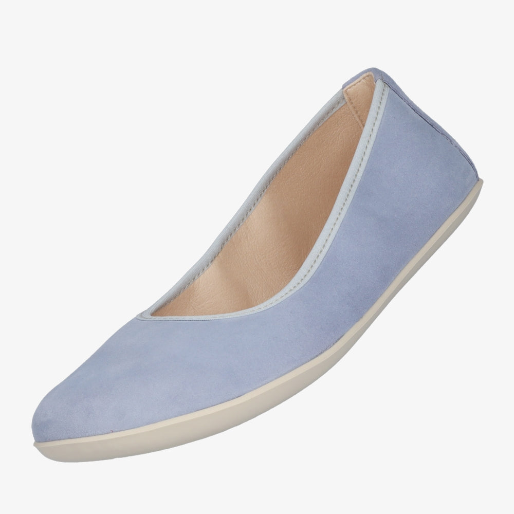 A photo of Groundies Lily Soft flats with a leather upper and cream rubber true sense soles. The flats are a nubuck in a light blue color, the trim around the tops of the flats is a baby blue color and is lighter than the rest of the flats. The interior of the flats is a light beige color. The left flat is shown floating angles downward against a white background. #color_light-blue