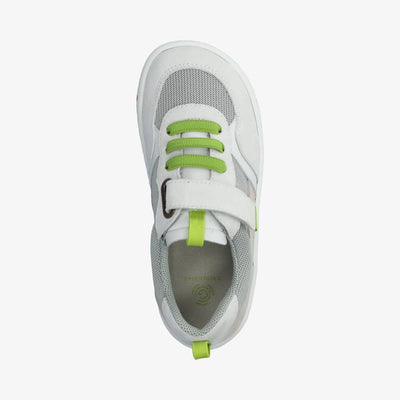 Photo 1 - A photo of Groundies Lou kids sneakers in grey/white with white soles. Shoes are made of grey mesh with light beige suede detailing around the back sole and light grey suede detailing around the front sole and laces. Lime green pull tabs are present on the tongue, heel, and end of the velcro closure. Elastic laces are lime green. Right shoe is shown from the right side against a white background. Photo 2 - Right shoe is shown from the top down against a white background. #color_grey-white