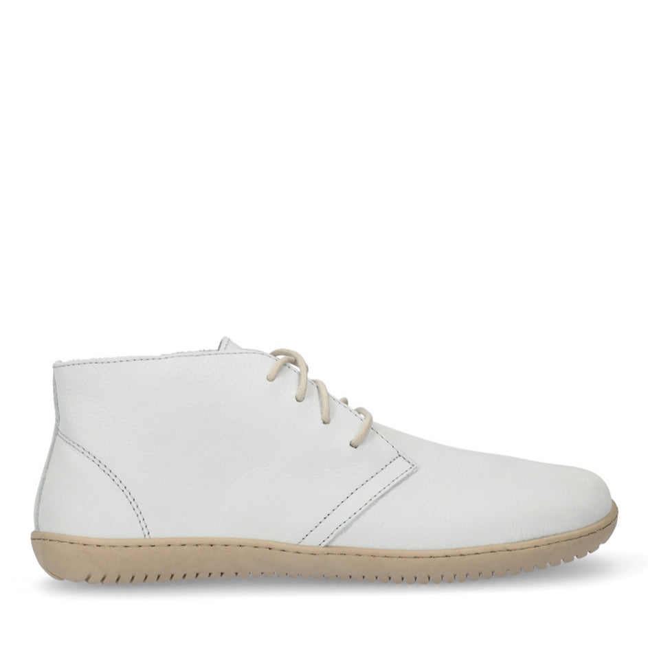 Photo 1 - A photo of Groundies Milano leather lace ups in white. Shoes are a low ankle height with tan soles and thin cream laces.The right shoe is shown from the right side against a white background., Photo 2 - Right shoe is shown from the top down against a white background. #color_leather-sand