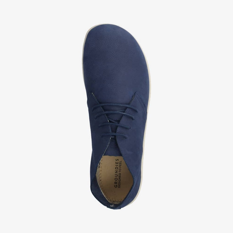 Photo 1 - A photo of Groundies Milano soft leather lace ups in dark blue. Shoes are a low ankle height with cream soles and thin blue laces.The right shoe is shown from the right side against a white background., Photo 2 - Right shoe is shown from the top down against a white background. #color_blue