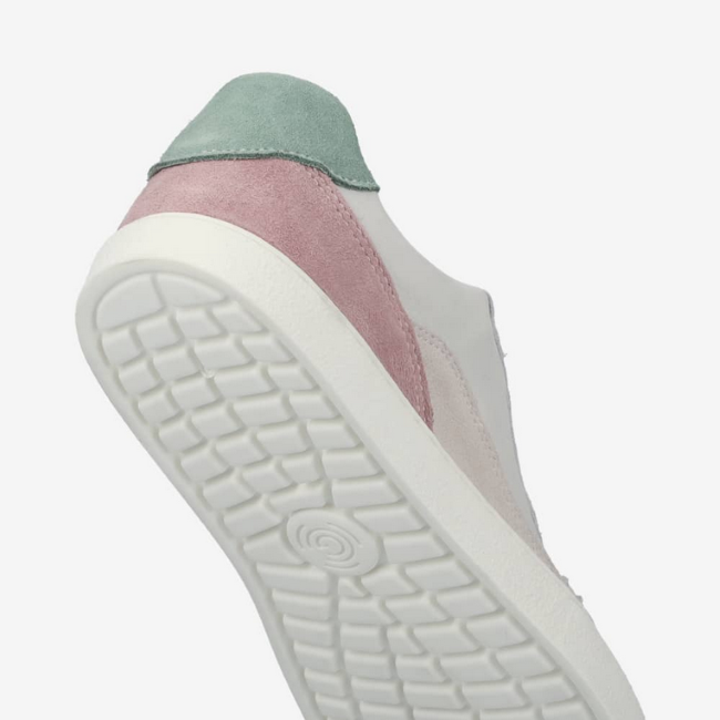 A photo of Groundies Nova sneakers made from leather and rubber soles. The sneakers are beige and white with pink/green accents on the heel, they also have perforation on the toe box. The right sneaker is shown up close from the sole against a white background.  #color_beige-green-pink
