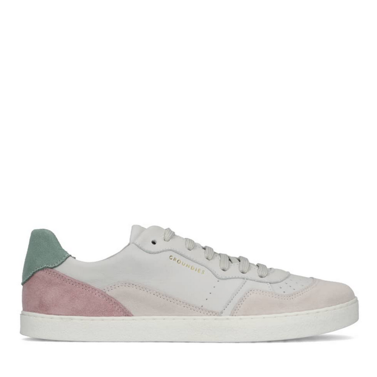 A photo of Groundies Nova sneakers made from leather and rubber soles. The sneakers are beige and white with pink/green accents on the heel, they also have perforation on the toe box. The right sneaker is shown from the right side against a white background. #color_beige-green-pink