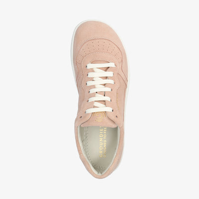 A photo of Groundies Nova sneakers made from nubuck leather and rubber soles. The sneakers are a rose color with white laces, they also have perforation on the toe box. The right sneaker is shown over top facing upright on a white background. #color_rose