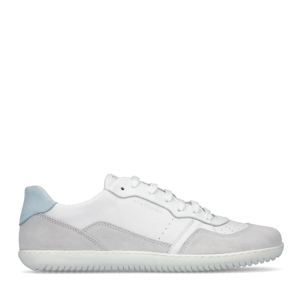 A photo of Groundies Nova GO1 Sneakers made with soft leather and white rubber soles. The sneakers have White, Grey, and light blue color blocks. Right shoe is shown on the right side against a white background in this photo. #color_white-blue