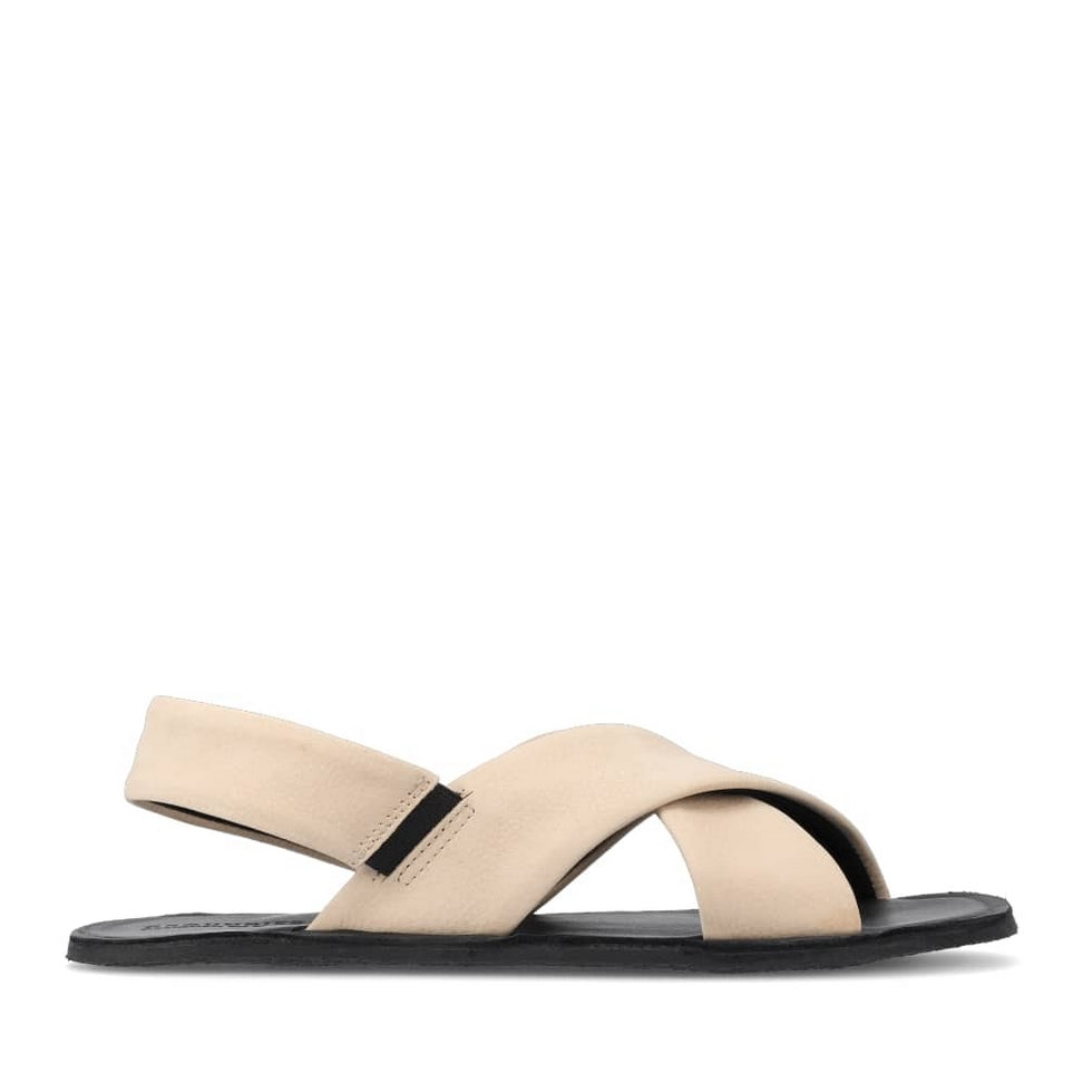 Photo 1 - A photo of Groundies Verona leather sandals in beige. Two thick straps make an X across the foot while a thinner strap keeps the sandal secure to the foot. The right shoe is shown from the right against a white background. Photo 2 - Left shoe is shown floating diagonally from the left against a white background.  #color_beige