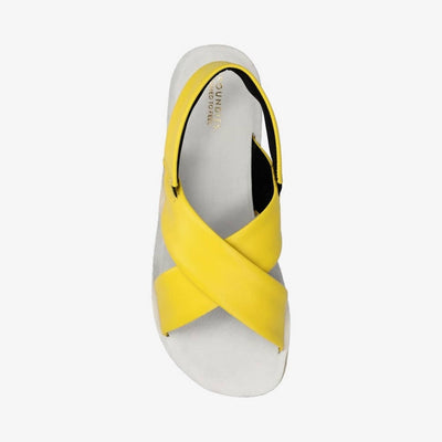 Photo 1 - A photo of Groundies Verona leather sandals in yellow. Two thick straps make an X across the foot while a thinner strap keeps the sandal secure to the foot. The right shoe is shown from the right against a white background. Photo 2 - Right shoe is shown from the top down against a white background.  #color_yellow