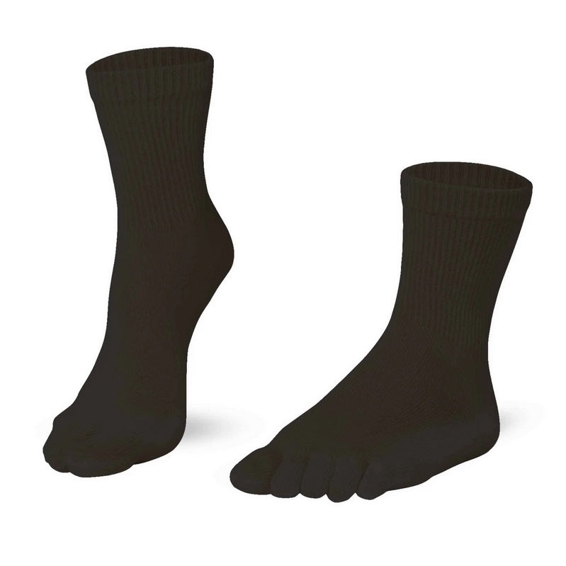 A photo of Knitido essential midi crew toe socks made with cotton, nylon, and elastane. The socks are a  black color. Both socks are shown beside each other angled slightly to the left, one of the socks heel is lifted off the floor against a white background. #color_black