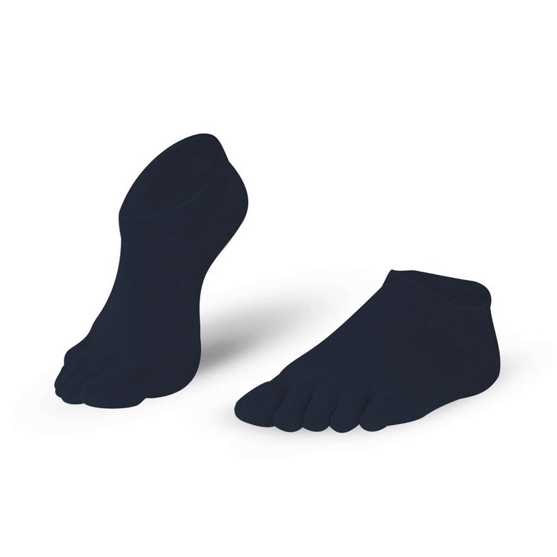 A photo of Knitido low cut toe socks made with cotton, elastane, nylon, and polyester. The socks are black in color. They are shown angled slightly to the left, one sock is shown with the heel lifted with the toes still resting on the ground against a white background. #color_black