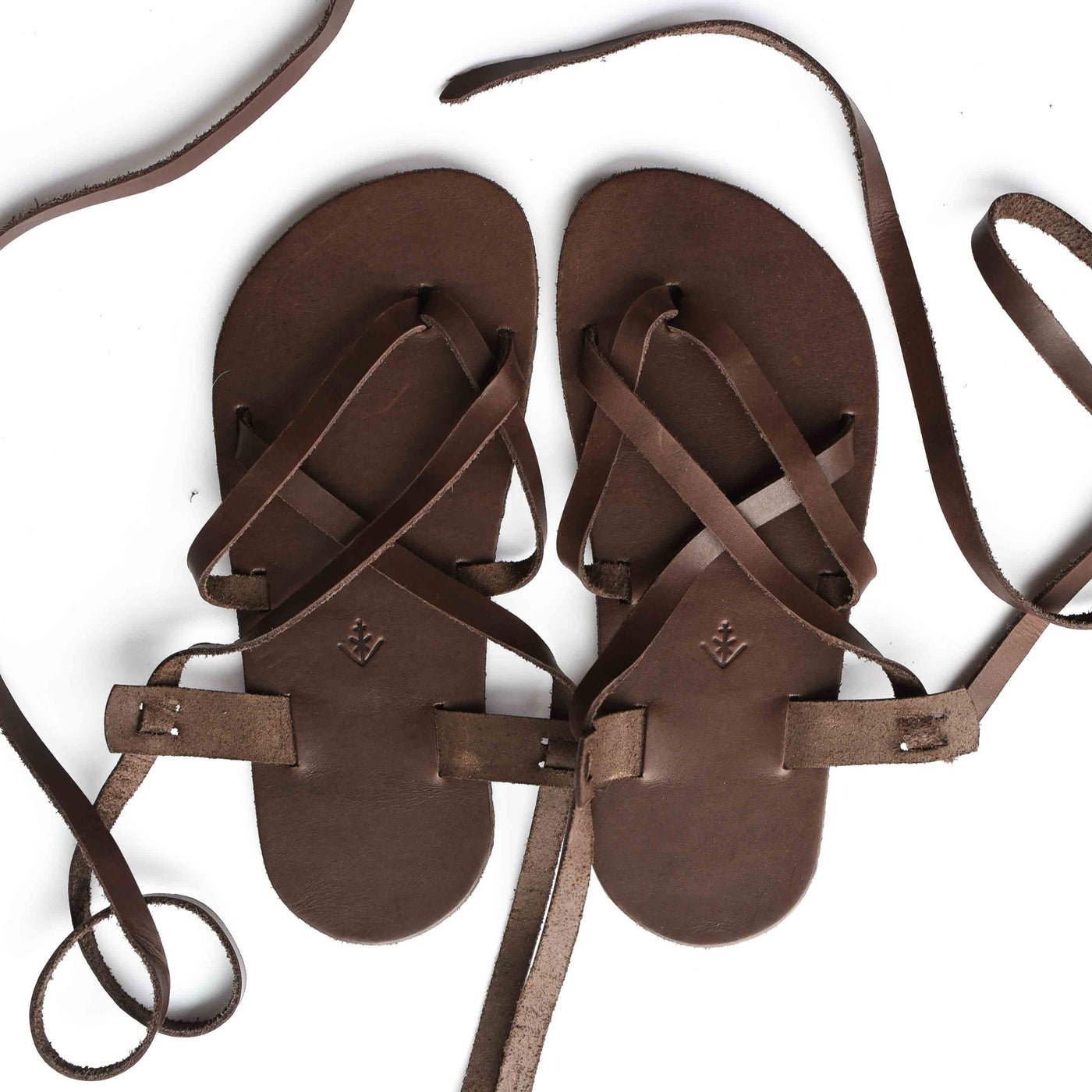 a brown leather strappy sandal shown from above on a white background #color_brown