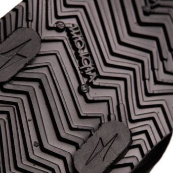 A photo of black Shamma Warrior adventure sandals made with fabric straps and a rubber sole. A close up of the soles with lots of traction is shown here. #color_black