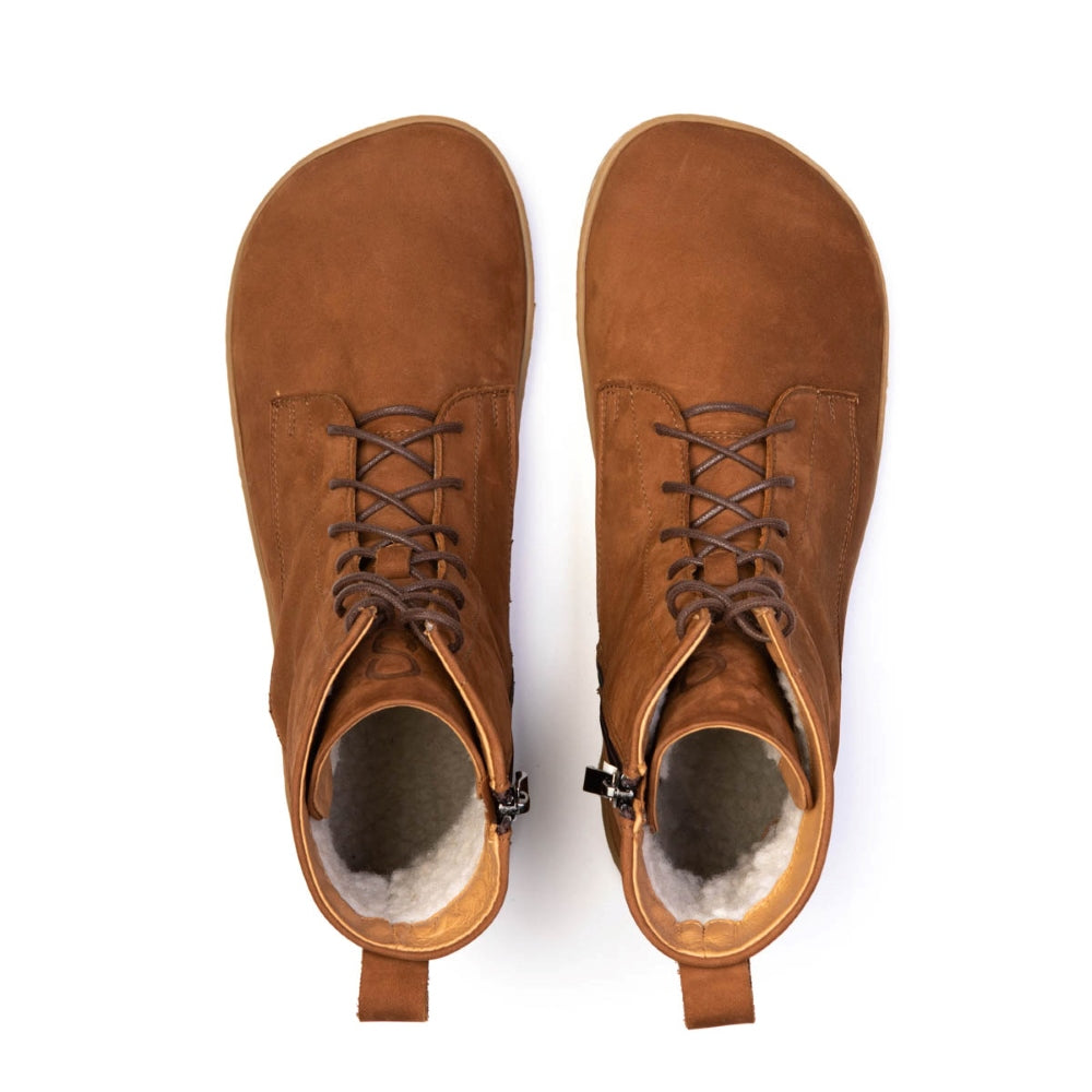A photo of the Shapen Cozy lace up boots made from a water resistant nubuck leather upper, wool lining, and brown rubber soles. The boots are brown in color with brown laces and have a zipper on the inner side. Both boots are shown together from above on a white background. #color_brown