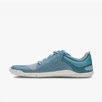 A photo of Vivobarefoot Primus lite sneakers made from recycled plastic and a rubber sole. The athletic sneakers are a blue haze color with white soles spotted with color with the vivobarefoot logo on the side. The right shoe is shown from the left side against a white background. #color_blue-haze