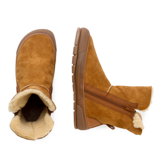 A photo of Zapatos Feroz Alcoy made with suede, sheepskin, and rubber soles. The boots are nut brown in color with rubber around the soles and a zipper on the side. Both boots are shown from above the left boot is facing upright and the right boot is lying on its right side against a white background. #color_nut-brown